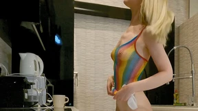 The girl is in a see-through fishnet dress and she is showing off her abs Then she unzips the top of her dress The girl is in a see-through fishnet dress and she is showing off her abs Then she unzips the top of her dress