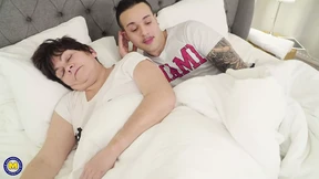 Energetic adult woman engaging in sexual activity with a youthful man Energetic adult woman engaging in sexual activity with a youthful man