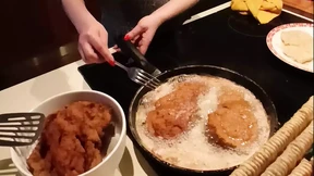 Deep throating hubby's beast while whipping up a culinary delight