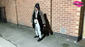 Street hoe jiggling for stranger on sidewalk