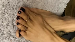 Black Nail Polish sy tiny feet with long toes with toe rings