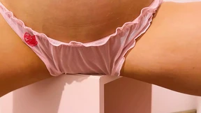 Pink-clad femme fatale ravishes the tabletop in a passionate, all fours display Pink-clad femme fatale ravishes the tabletop in a passionate, all fours display