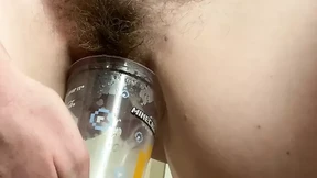 Desperate MILF rushes back to hotel to do HUGE piss in a plastic cup! After filling it once, she strips naked to finish it off