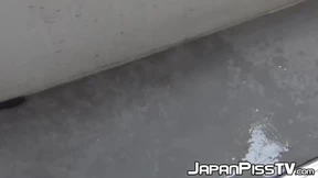 Gorgeous Oriental minx spilling urine on staircase