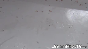 Japanese chick takes off her dress to piss outside in public