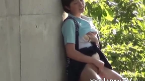 Japanese cutie rubbing her pussy at a hidden outdoor place