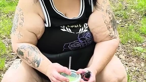 Sucking on a Straw in the Woods Squirting on Tree on Her Knees