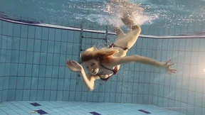 Blonde beauty splashes seductively nude, arousing desires in sultry aquatic escapade Blonde beauty splashes seductively nude, arousing desires in sultry aquatic escapade