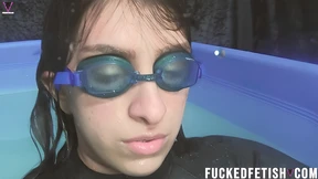Close-up of Mia in cold pool with black neoprene