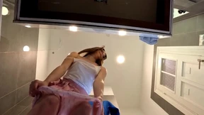  Busty brunette in a pink mini skirt flaunts her legs and behind