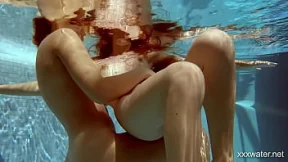 Two sultry sirens splash in scorching swimming waters, their bodies begging to be ravaged Two sultry sirens splash in scorching swimming waters, their bodies begging to be ravaged