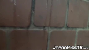 Shameless Asian babe spied on while peeing outdoors