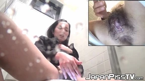 Japanese lady closeup filmed peeing and teasing clit