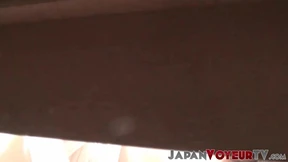 Japanese vixen toys with herself while taped by voyeur