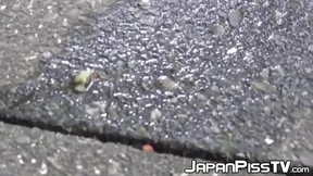 Tantalizing Japanese girl peeing in front of someone bicycle