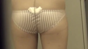 Voyeur gazing at Japanese babe stripping stockings