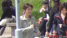 Athletic Asian teenagers change clothes in public