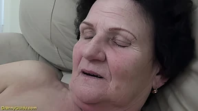 Senior milf eagerly enjoys intense sex with her youthful partner
