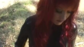 Latex lesbians Aradia and Krissy enjoy outdoor BDSM