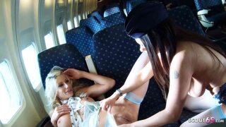 Two lesbian stewardesses with big tits do it in the