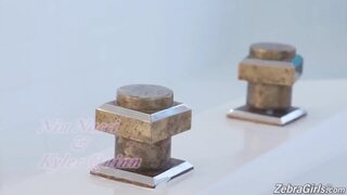 Kyler Quinn and Busty ebony Nia Nacci have interracial lesbian sex in the bathroom