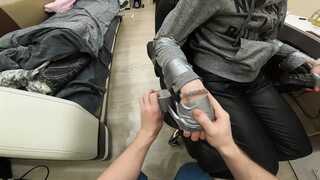 Kinky BDSM scene: Bound beauty in silver restraints, leather thigh-highs,