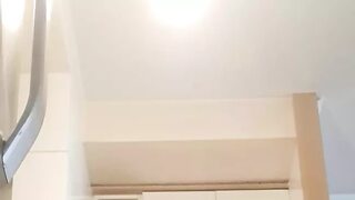 In the kitchen, relaxed, supported on her back